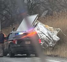 damaged truck in the ditch as seen by passing motorist